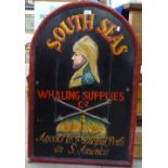 A painted wooden sign with embossed decoration "South Seas Whaling Supplies Co", height 91cm