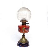 Antique oil lamp with painted glass font and etched globe shade, height 59cm overall