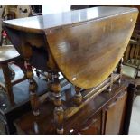 A large reproduction oak gateleg table, on baluster turned legs, W108cm