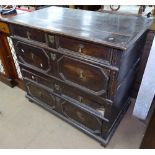 An 18th century oak 2-section chest in Jacobean style, having 4 long drawers with moulded fronts, on