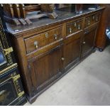 An 18th century joined oak dresser base, with 2 frieze drawers, cupboards under, bracket feet,