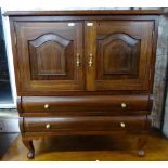 A reproduction hardwood cabinet, with cupboards and 2 long drawers, with brass-strung inlaid