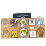 A display of Vintage car badges on pine mount