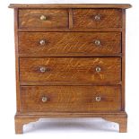 A table-top oak apprentice chest of 2 short and 3 long drawers, height 36.5cm