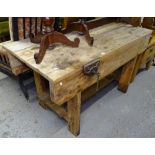 A Vintage pine workbench of plank construction, fitted with Record no. 55 vice, L152cm, H86cm, D76cm