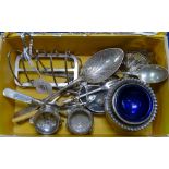 Silver plated toast rack, sugar nips, pair of table salts, serving spoon etc