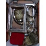 Silver-fronted photo frames, a pair of Indian white metal goblets, silver bangle etc