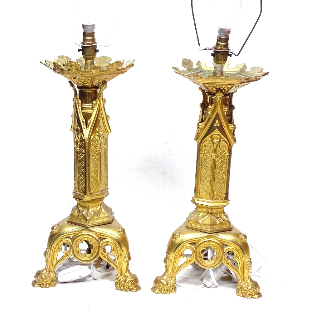 A pair of Continental gilt-brass candlesticks converted to table lamps, height to top of fitting