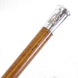 A silver-topped Malacca cane "Uganda Prisons", below an embossed peacock