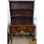 WITHDRAWN An 18th century oak dresser, with later plate rack, base fitted with 3 short drawers,