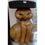 A carved hardwood jardiniere stand in the form of a cat, H47cm