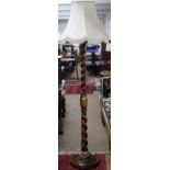 A 1920s oak barley twist standard lamp and fluted shade