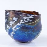 A handmade Studio coloured glass iridescent bowl with shaped rim, height 10cm