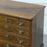 A George III mahogany batchelor's chest of 4 long drawers of small size, with brushing shandles