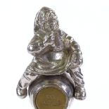 A nickel plate car mascot in the form of a man on a beer barrel, height excluding screw 12cm