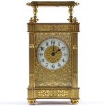 An ornate French gilt-brass cased 8-day carriage clock, with pierced fretwork gilt and enamel