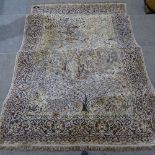 WITHDRAWN A large Antique Persian silk rug, with exotic bird decoration, 9'5" x 6'8"