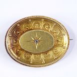A Victorian unmarked gold oval brooch, with central rose-cut diamond set panel, brooch length 37.