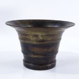 An Antique patinated bronze mortar, diameter 12cm