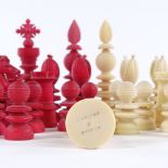 A 19th century red and white stained ivory chess set, white King stamped Jaques London, King