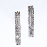 A pair of 18ct gold diamond hoop earrings, with pierced shape back settings, total diamond content
