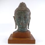An Oriental archaic verdigris bronze Buddha's head, thought to be 13th/14th century, on modern