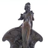A reproduction bronze letter rack, after Claude Mirval, in the form of standing woman, on black