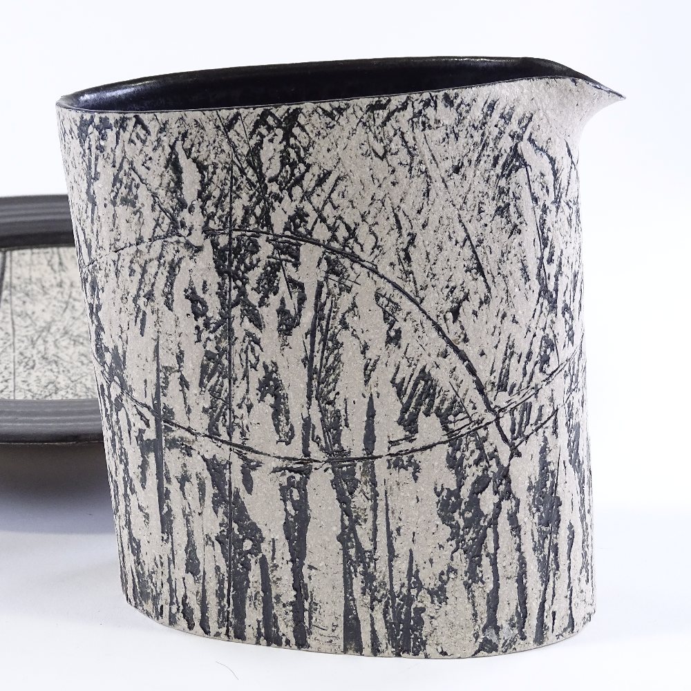 Louise Darby (British - born 1957), a Studio pottery jug and charger, black glaze with incised and - Image 4 of 5