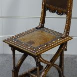 A 19th century Moorish hall chair, with inlaid ivory parquetry decoration and carved insets