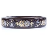 A Victorian gold silver and tortoiseshell pique inlay bangle, with floral decoration, internal