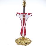 A Bohemian overlay glass table lamp on cast ormolu base, circa 1900, height to rim 29cm