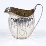 A George III silver cream jug, with bright-cut swag decoration, possibly by Henry Nutting or