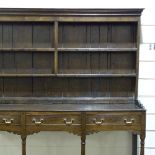 A George III joined oak Welsh dresser, with boarded plate rack, 3 frieze drawers and pot board