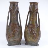 A pair of Art Nouveau gilded and patinated spelter vases, circa 1900, by J Garnier, with relief