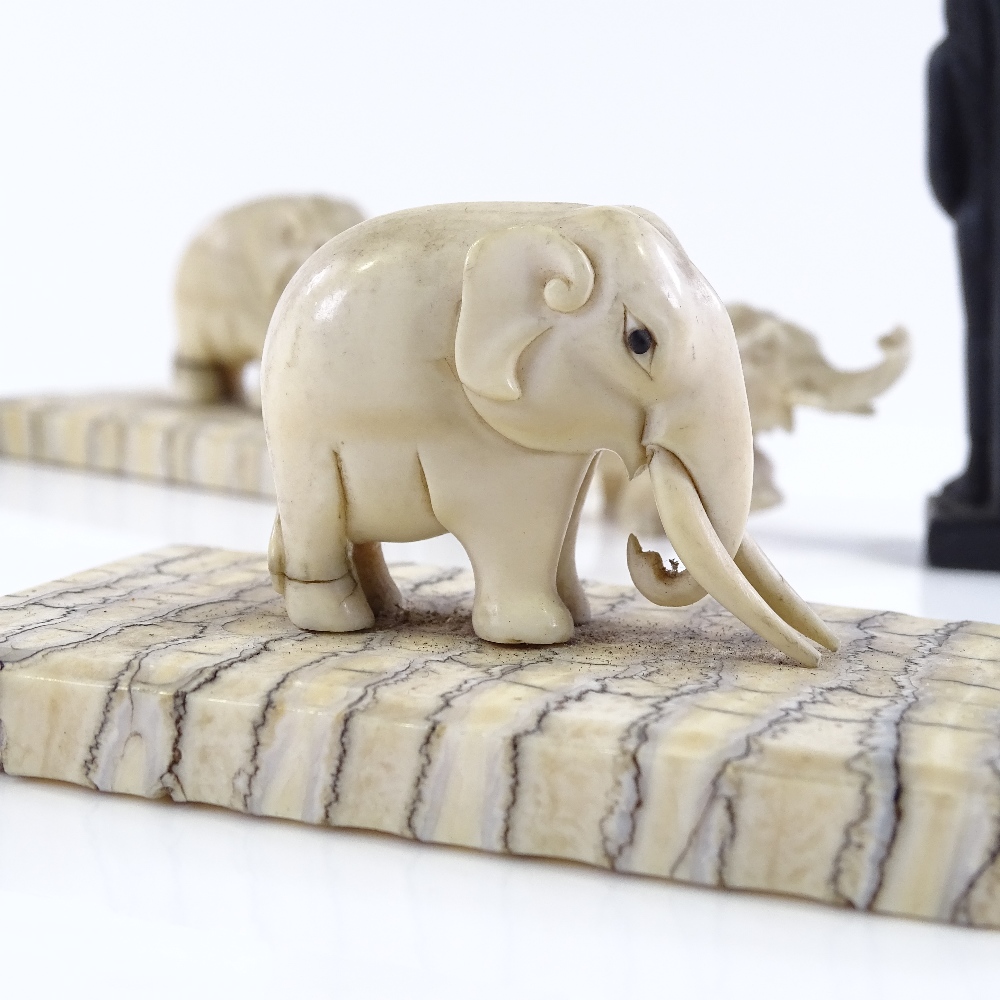 A small group of Indian carved ivory elephant figures, circa 1900, including one with gilded - Image 3 of 3