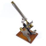 A Victorian nickel plate and brass student's microscope, by Baker of High Holborn London, in