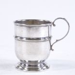 A small silver cylindrical christening mug, by William Suckling Ltd, hallmarks Birmingham 1953,