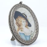 An oval miniature painted portrait of Lady Devonshire, in nickel plate frame, overall length 11.5cm