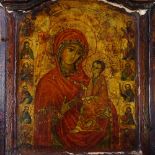 An Antique carved painted and gilded wood Russian triptych icon, height 37cm