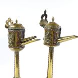 A pair of unusual copper and brass lamps, circa 1900, possibly Middle Eastern, height 33cm