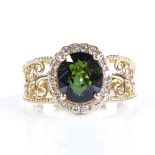 A 14ct gold green tourmaline and diamond cluster ring, oval-cut tourmaline approx 2.95ct, total