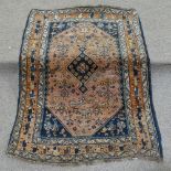 A Persian handmade wool rug, 4'2" x 2'11"