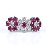 An 18ct white gold ruby and diamond flowerhead dress ring, setting height 9.4mm, size M, 5g