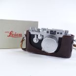 A Leica 111G camera, serial no. 968523, with original Leica lens, leather case, original box, and