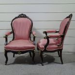 A pair of mahogany-framed fireside armchairs, with carved show wood surrounds, and ornate brass