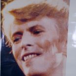 A David Bowie poster print, unframed