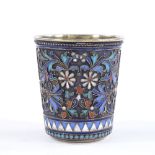 A 19th century small Russian silver and enamel drinking tot, with floral design champleve enamel