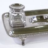 An Edwardian silver desk stand, with silver-topped glass inkwells, by Stephenson & Sons, hallmarks