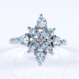 An 18ct white gold Paraiba tourmaline and diamond cluster dress ring, setting height 16.4mm, size N,