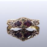 A Victorian 15ct gold garnet and peridot ring, setting height 7.1mm, size Q, 1.8g